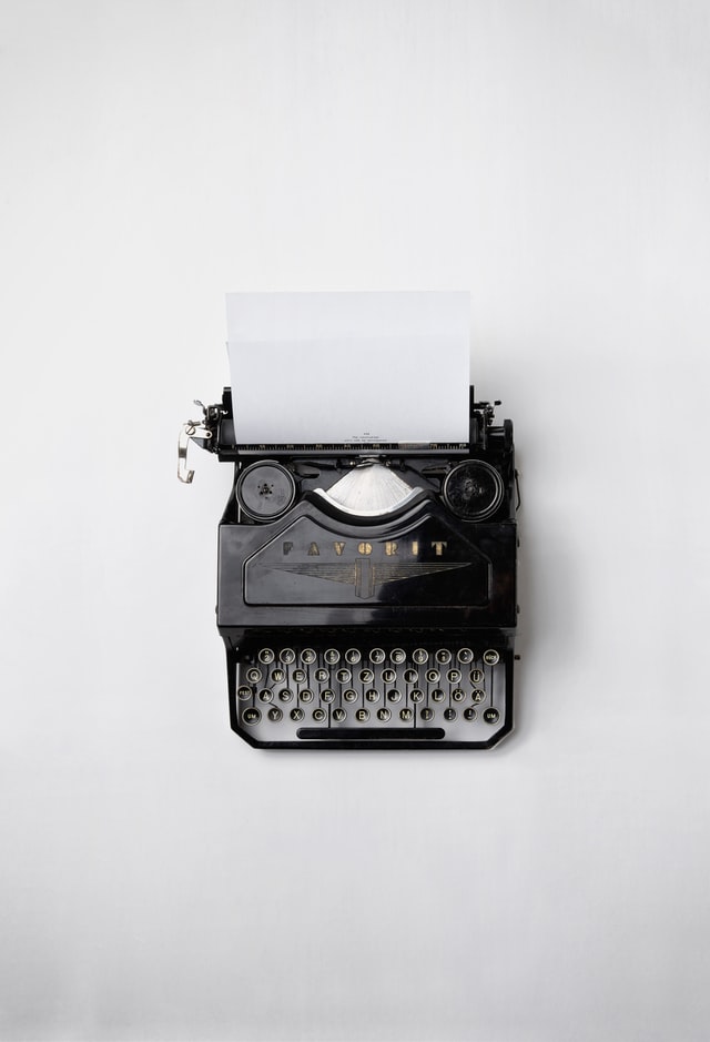 typewriter with white paper